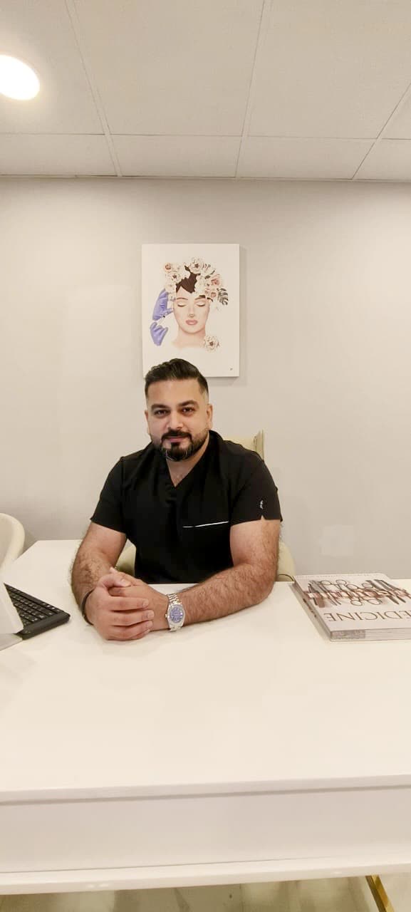 Dr. Usman at his clinic desk