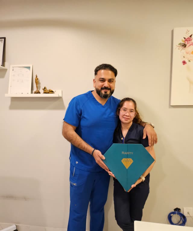 Dr. Usman with a team member